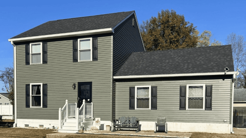 Two-story modern suburban house with gray siding and white trim